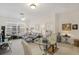 Bright and airy living room with a view into the bedroom at 13524 Turtle Marsh Loop # 638, Orlando, FL 32837