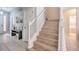 Elegant staircase with white railings and light wood steps at 742 Orange Cosmos Blvd, Davenport, FL 33837