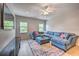 Comfortable Gathering room with sectional sofa and large TV at 742 Orange Cosmos Blvd, Davenport, FL 33837