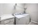 Laundry room with washer, dryer, and overhead shelving at 742 Orange Cosmos Blvd, Davenport, FL 33837