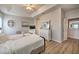 Spacious bedroom with king-size bed, dresser, and access to hallway at 742 Orange Cosmos Blvd, Davenport, FL 33837