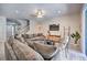Comfortable living room with ample seating and views to the pool area at 742 Orange Cosmos Blvd, Davenport, FL 33837