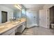 Modern bathroom with double vanity, walk-in shower, and toilet at 742 Orange Cosmos Blvd, Davenport, FL 33837