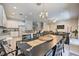 Open kitchen and dining area with modern appliances and island at 742 Orange Cosmos Blvd, Davenport, FL 33837