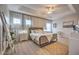 Main bedroom with king-size bed and plenty of natural light at 742 Orange Cosmos Blvd, Davenport, FL 33837