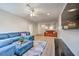 Open Gathering room with sectional sofa and view to another room at 742 Orange Cosmos Blvd, Davenport, FL 33837