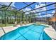 Enjoy this private screened pool and spa with plenty of lounge space at 742 Orange Cosmos Blvd, Davenport, FL 33837