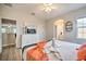 Bright bedroom with a king-size bed and ensuite bathroom at 742 Orange Cosmos Blvd, Davenport, FL 33837