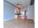 Open concept living room with hardwood floors and ceiling fan at 150 E Robinson St # 6S-15 631, Orlando, FL 32801