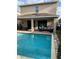 Enjoy this refreshing pool with a covered patio at 7405 Marker Ave, Kissimmee, FL 34747