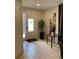 Bright and airy entryway with tiled floors and tall potted plant at 7405 Marker Ave, Kissimmee, FL 34747