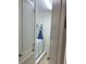 Laundry room with washer, dryer, and ironing board at 7405 Marker Ave, Kissimmee, FL 34747
