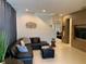 Spacious living room with sectional sofa and view into dining area at 7405 Marker Ave, Kissimmee, FL 34747