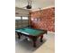 Game room with pool table and sports-themed decor at 7405 Marker Ave, Kissimmee, FL 34747