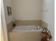 Soaking tub and neutral tile at 7405 Marker Ave, Kissimmee, FL 34747