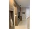 Bright hallway with built-in entertainment center and wood-like wall at 7405 Marker Ave, Kissimmee, FL 34747