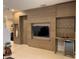 Modern living room with built-in entertainment center and wine cooler at 7405 Marker Ave, Kissimmee, FL 34747