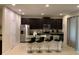 Modern kitchen with dark cabinetry and an island at 7405 Marker Ave, Kissimmee, FL 34747