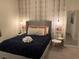 Guest bedroom with plush bedding and modern decor at 7405 Marker Ave, Kissimmee, FL 34747