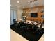 Formal dining room featuring a long table and modern chandelier at 7405 Marker Ave, Kissimmee, FL 34747