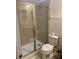 Clean bathroom with a glass shower and toilet at 7405 Marker Ave, Kissimmee, FL 34747