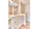 Updated bathroom with white vanity, quartz countertop, and modern light fixture at 28 Golf Villa Dr, Port Orange, FL 32128