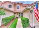 Townhouse entry with walkway and landscaping at 28 Golf Villa Dr, Port Orange, FL 32128