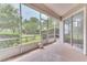 Relaxing screened porch overlooking a lush green backyard at 28 Golf Villa Dr, Port Orange, FL 32128