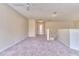 Upper-level hallway with carpeted floor and access to bedrooms and bathroom at 28 Golf Villa Dr, Port Orange, FL 32128