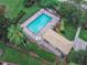 Community pool with lounge chairs and a pool house at 28 Golf Villa Dr, Port Orange, FL 32128