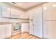 Kitchen with white cabinets and stainless steel appliances at 28 Golf Villa Dr, Port Orange, FL 32128