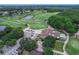 Aerial view of community featuring golf course, clubhouse, and homes at 28 Golf Villa Dr, Port Orange, FL 32128