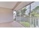 Screened porch with a view of lush greenery and trees at 28 Golf Villa Dr, Port Orange, FL 32128
