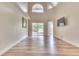 Spacious living room with vaulted ceilings and hardwood floors at 28 Golf Villa Dr, Port Orange, FL 32128