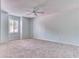 Light and airy bedroom with carpeted floor, ceiling fan, and a window with shutters at 28 Golf Villa Dr, Port Orange, FL 32128