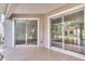 Spacious screened porch with sliding glass doors leading to the backyard at 28 Golf Villa Dr, Port Orange, FL 32128