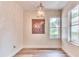 Bright dining room with hardwood floors and a large window at 28 Golf Villa Dr, Port Orange, FL 32128