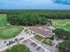 Golf course clubhouse with parking and golf carts at 28 Golf Villa Dr, Port Orange, FL 32128