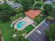 Community pool with surrounding lounge chairs and parking at 28 Golf Villa Dr, Port Orange, FL 32128