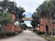 Community entrance with signature archway at 750 E Michigan St # 163, Orlando, FL 32806