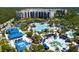 Aerial view of resort-style community with large pool and water features at 14501 Grove Resort Ave # 2740, Winter Garden, FL 34787