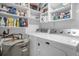 Laundry room with washer, dryer, and storage shelves at 4445 S Atlantic Ave # 606, Ponce Inlet, FL 32127