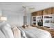 Bedroom with built-in shelves and king-size bed at 4445 S Atlantic Ave # 606, Ponce Inlet, FL 32127