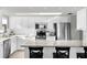 Modern kitchen with white cabinets, granite counters, and stainless steel appliances at 4445 S Atlantic Ave # 606, Ponce Inlet, FL 32127