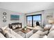 Spacious living room with sectional sofa and ocean view at 4445 S Atlantic Ave # 606, Ponce Inlet, FL 32127