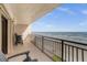 Stunning ocean view from a balcony with patio furniture at 4445 S Atlantic Ave # 606, Ponce Inlet, FL 32127