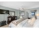 Main bedroom with king-size bed, dresser, and large TV at 4445 S Atlantic Ave # 606, Ponce Inlet, FL 32127