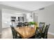Dining area with wood table and kitchen view at 4445 S Atlantic Ave # 606, Ponce Inlet, FL 32127