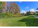 Landscaped backyard with a large grassy area and privacy fence at 11617 Waterstone Loop Dr, Windermere, FL 34786