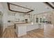 Elegant kitchen boasting a spacious island, custom cabinetry, and a stylish backsplash at 11617 Waterstone Loop Dr, Windermere, FL 34786